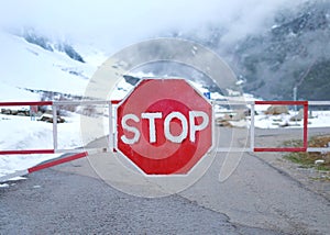 Red stop sign in the mountains