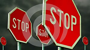 Red stop signs on the street. Roadside traffic signs for stopping with clouds time lapse footage in background.