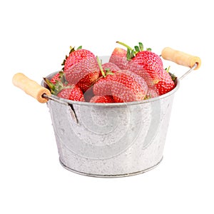 Red strawberry in iron bucket on white background