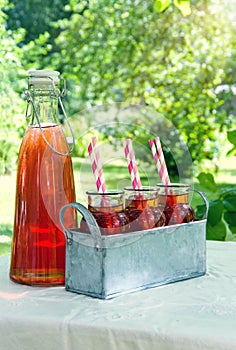 Red strawberry juice with striped straws