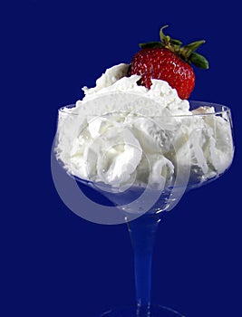 red strawberry in whipped cream