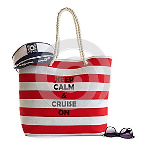 Red stripe beach bag, captains hat and sunglasses