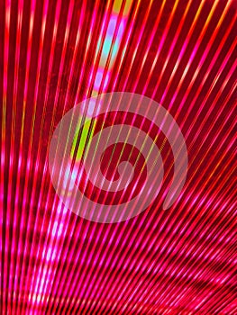 Red striped cloth. Colourful psychedelic pattern on a black background. The light shone into the background purple tunnel with