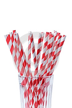 Red striped papaer straws in glass