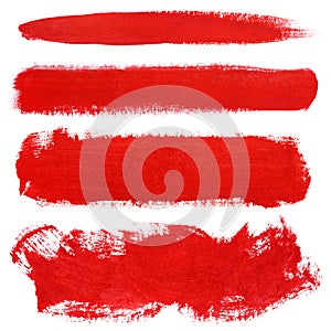 Red strokes of gouache paint brush