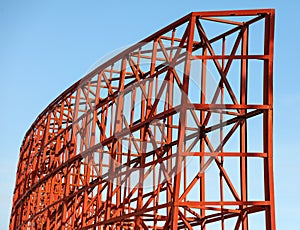 A red structure with a blue sky in the background