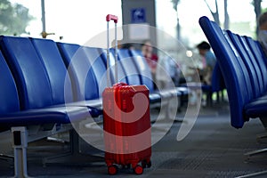 Red suitcase in the airport