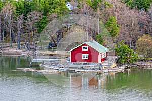 Red house on rocky shore of Ruissalo island, Finland