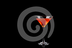 Red Summer Drink in Martini Glass isolated on black background