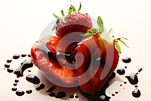 Red summer strawberries, seasonal fruit, macro photo with balsamic vinegar of Modena