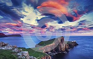 Red Sunset Clouds over Neist Point Lighthouse photo