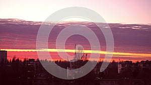 Red sunset over the city. Beautiful sky. Dramatic crimson clouds. Red thundercloud over Kiev, Ukraine, Europe. Landscape