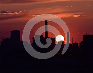 Red sunset over the city silhouette