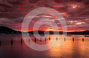 Red sunset over the estuary waters at Yattalunga