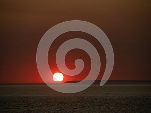 Red sunset over Lundy Island, viewed from Westward Ho.