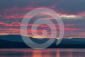 A red sunset over McLeod Lake at Whiskers Point Provincial Park, British Columbia, Canada