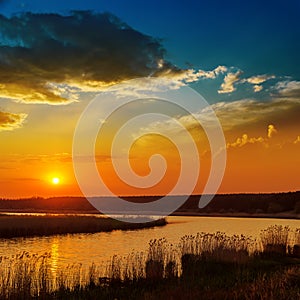 Red sunset over river