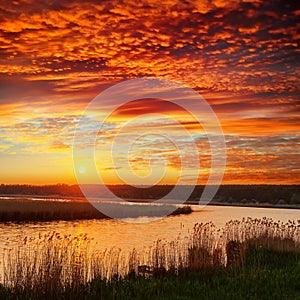 Red sunset over river
