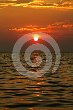 Red sunset over the sea. Beautiful sunset. Idyllic landscape with the sun setting over the sea horizon in the Croatian