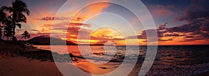 Red sunset panorama on the Caribbean beach with palm trees. Puerto Plata, Dominican Republic, Caribbean photo