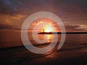 Red Sunset On Rompeolas Beach Aquadillia Puerto Rico USA photo