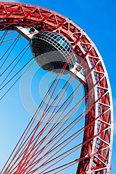 Red suspended bridge construction in Moscow