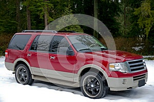 Red suv in winter