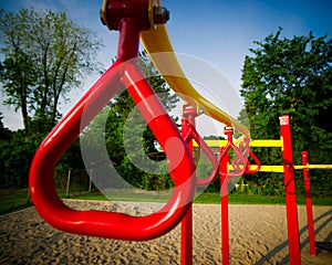 Red Swing Bars on Outdoor Play Structure