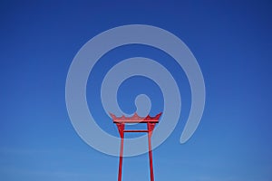 Red swing on blue sky in Bangkok Thailand