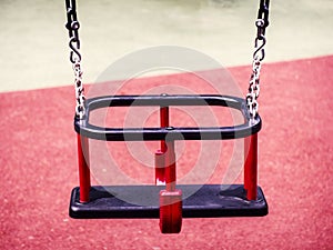 red swing for children