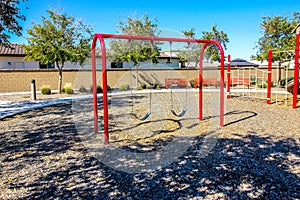 Red Swing Set At Local Neighborhood Park