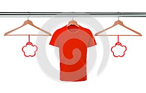 Red t-shirts on hangers and blank tags isolated on white