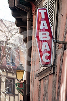 red tabacco sign with french text tabac, the traduction in english of tobacco