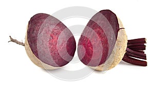 Red table beets in section isolated on white background