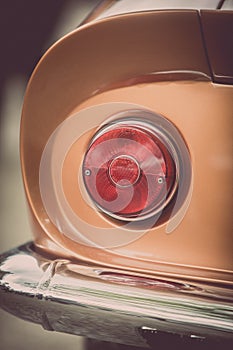 Red tail light of a classical vintage car