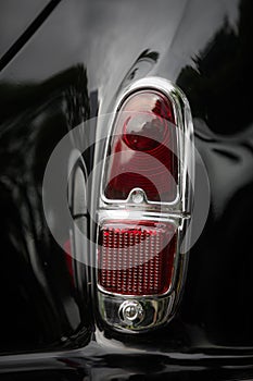 Red tail light of a classical vintage car