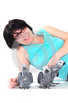 Red tale parrot on white kissing with female