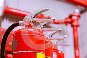 Red tank of fire extinguisher Overview of a powerful industrial fire extinguishing