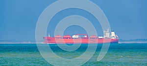 Red tanker ship transporting cargo near breskens and vlissingen, Zeeland, The Netherlands