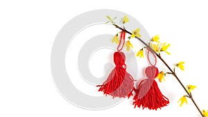 Red tassel Baba Marta symbol Martenitsa on white card. International Martisor day celebrate spring arrival. Greetting