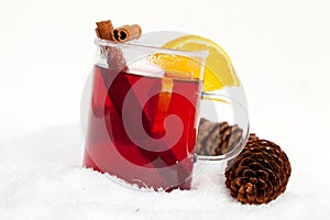 Red tea with cinnamon sticks and orange