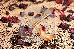 Red tea (karkade) on the table with a spoon