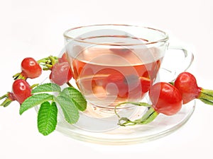 Red tea with wild rose hip berries