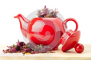 Red teapot with healing herbs