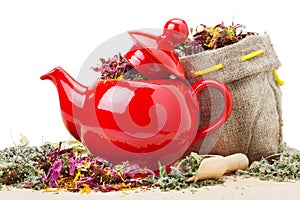 Red teapot, sack with healing herbs