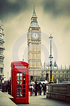 Red telephone booth and Big Ben in London, UK.