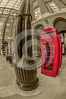 Red telephone booth in Hays Galleria, London