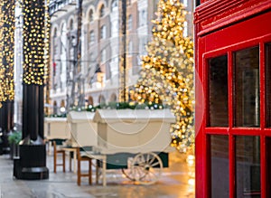 Red telephone booth in London in Christmas holiday