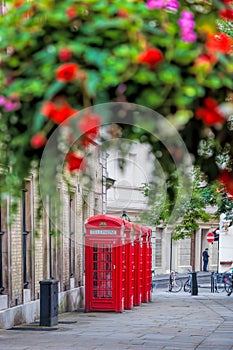 Red telephone booths in Covent Garden street, London, England