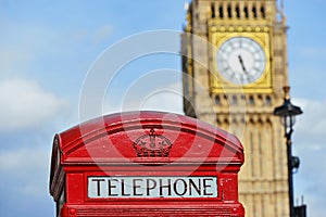 Red Telephone Box with the Clock Tower of Big Ben in London